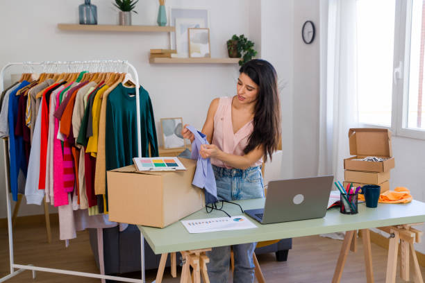 istock Female entrepreneur preparing online orders at home office 2159125845