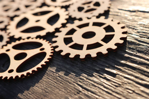 Wooden gears on wooden brick with copy space