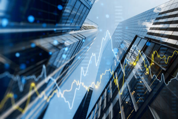 a double exposure image of skyscrapers with overlay of financial graphs, set against a blurred background, illustrating the concept of business growth - aktiemarknad och börs bildbanksfoton och bilder