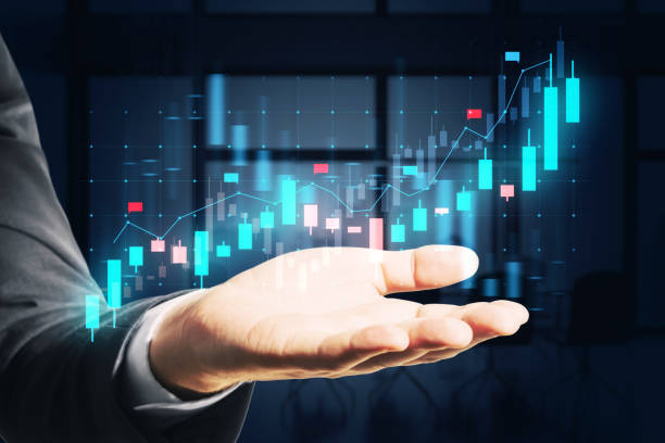 istock A person's hand with a financial graph hologram hovering above, set on a blurred office background, symbolizing business analysis 2159126768