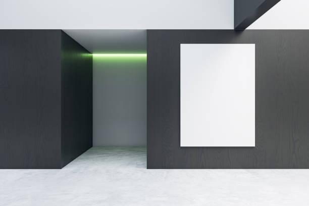 istock A black and white minimalist interior design with an empty frame on the wall, and green accent lighting. Modern concept. 3D Rendering 2159127004