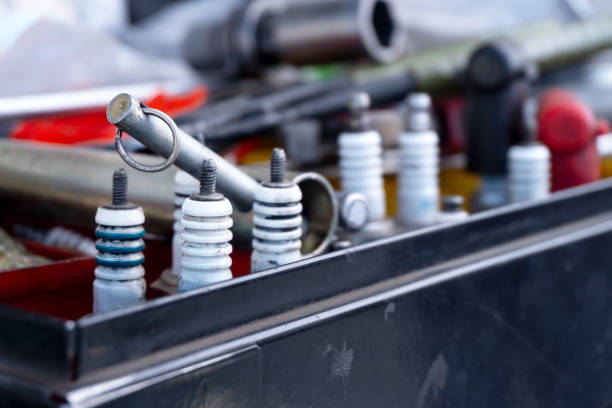 spark plugs in a box with accessories. Preparing sports racing cars for competitions. Pit stop