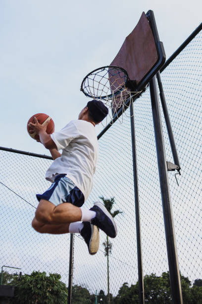 istock Playing Basketball Outdoors 2159128380