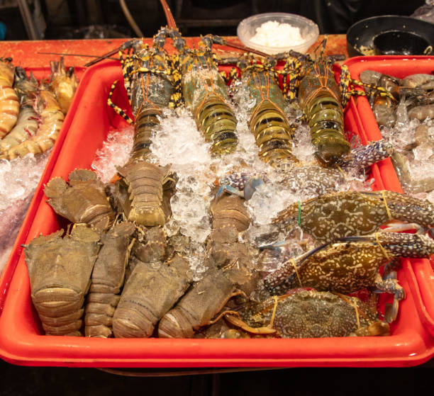 istock Shrimp and crayfish on ice at the market. 2159128577