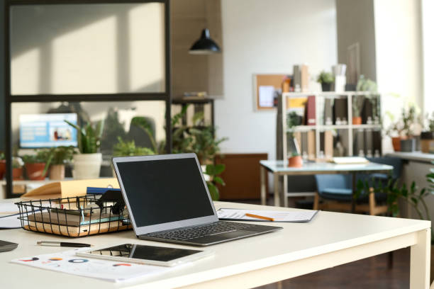 istock Blank Screen Laptop in Sunlit Office 2159129518