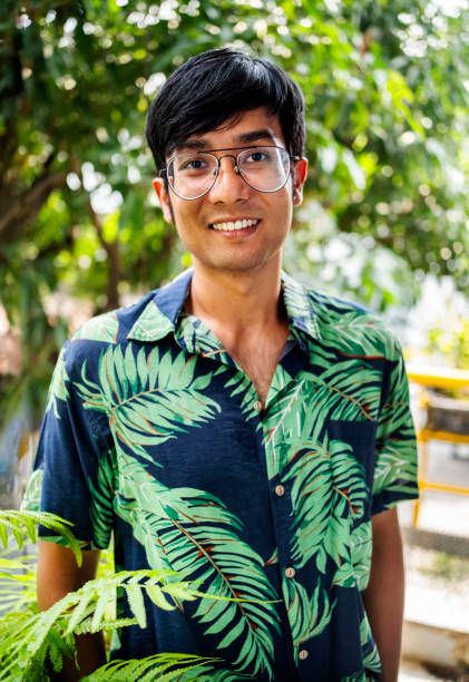 istock Confident young man in hawaiian shirt standing in a balcony 2159132793