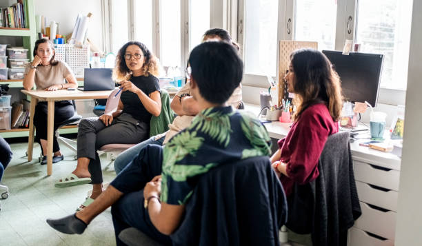 Team discussion on new project in non-profit organization office