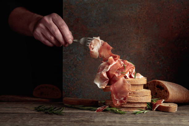 istock The hand of a prosciutto thief. 2159133168