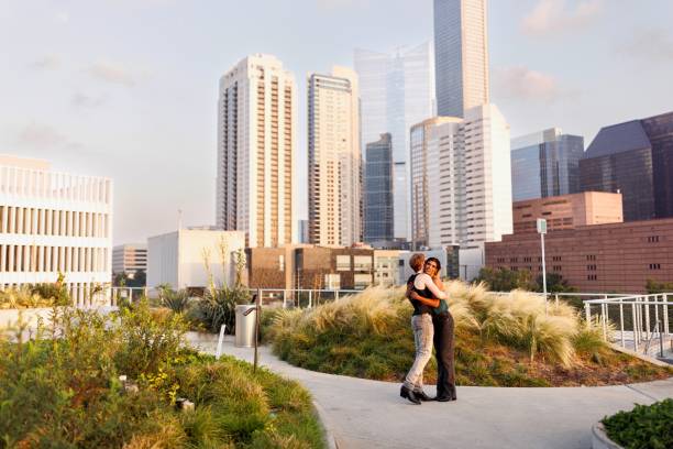 istock Two men hugging while enjoying in the city 2159133549