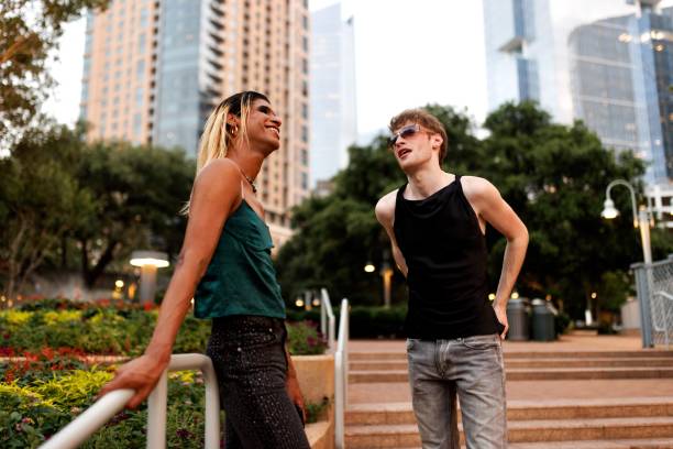 istock Friends walking and relaxing  in the beautiful park 2159133719