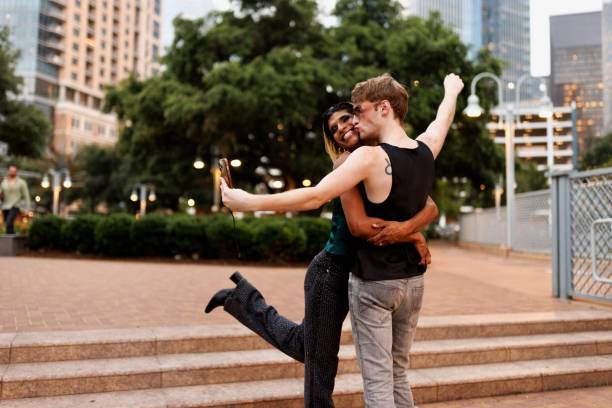 istock Gay friends taking funny selfies while exploring the city 2159133779