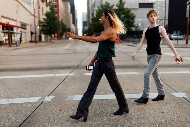 istock Queer couple walking in the downtown district 2159133798