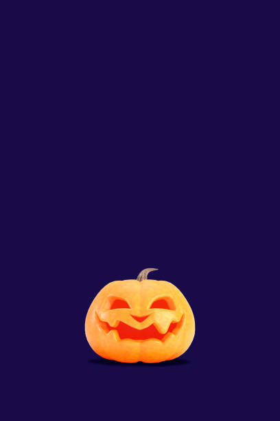 Jack o lantern isolated on purple color vertical background for halloween concept. Smiling orange pumpkin backdrop idea, social media template design.