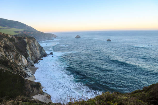 istock Big Sur, California, landscape, coastal, breathtaking, scenery, sunsets, sunrises, cliffs, Pacific Ocean, rugged, coastline, panoramic, views, serene, beauty, natural, wonder, golden hour, twilight, horizon, sea, waves, crashing, shore, dramatic 2159134321
