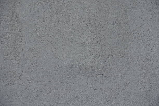 istock Background - gray wall with coarse roughcast finish 2159135675