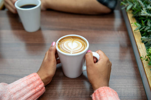 Point of View Holding Coffee Cup