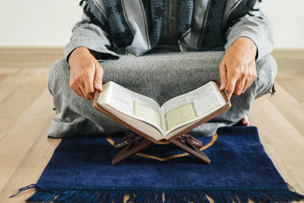 istock Muslim Man Reading Koran 2159137810
