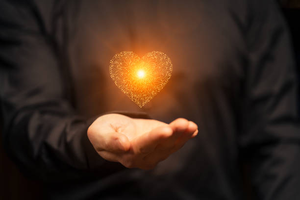 istock Artificial intelligence Circuit board heart symbol in mens hand 2159138219