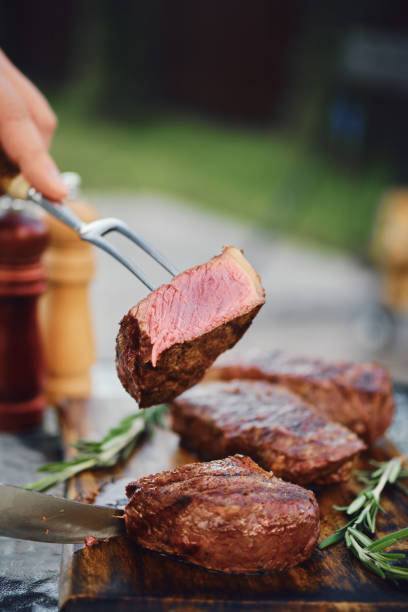 istock Piece of grilled strip steak on the fork 2159138491