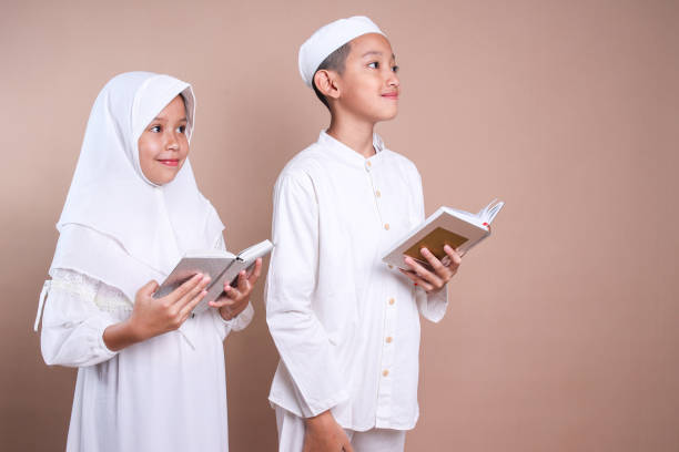 Elementary age girl wearing traditional attire holding a book, symbolizing education and cultural heritage