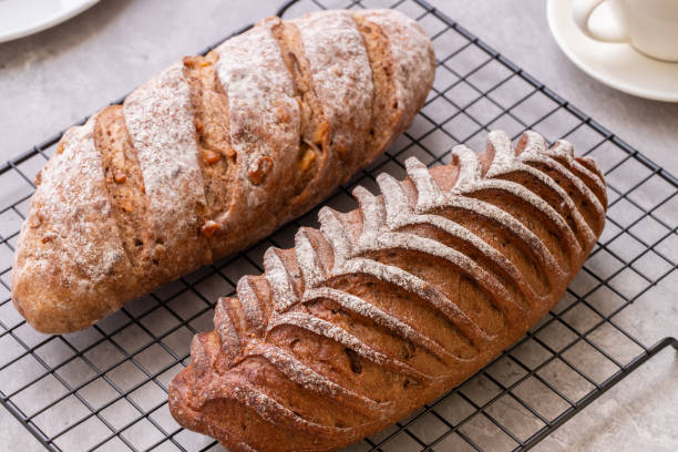 Two Loaves of Different Rye Bread on Cooling Rack Close-up
