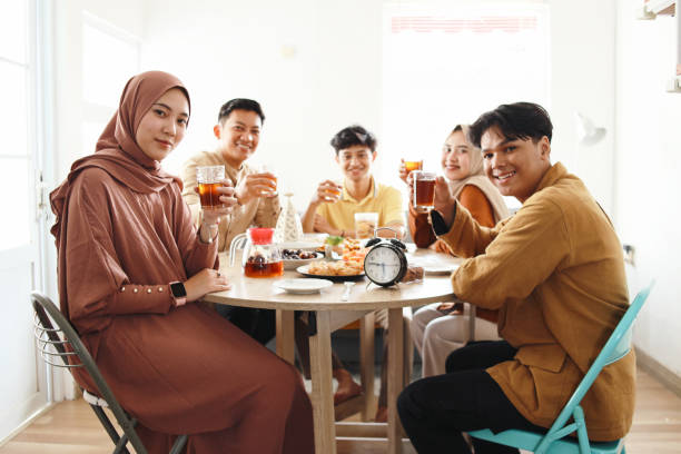 istock Muslim Friends Break Fasting Together 2159140690