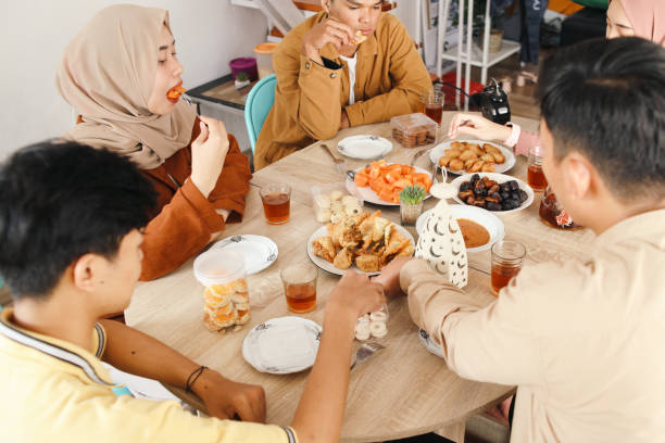 istock Muslim Friends Break Fasting Together 2159140844