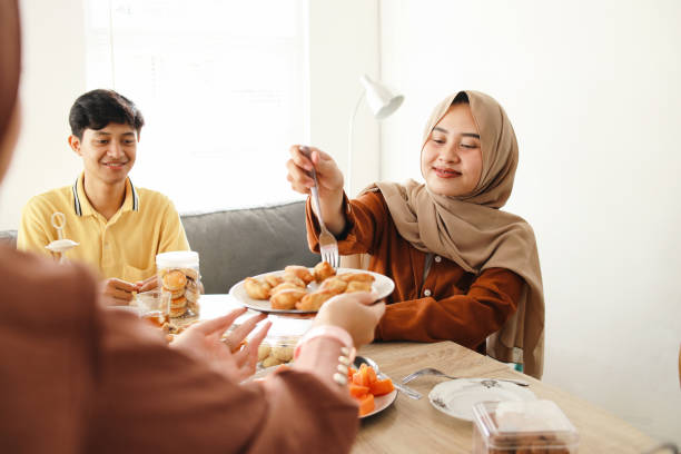 istock Muslim Friends Break Fasting Together 2159140865