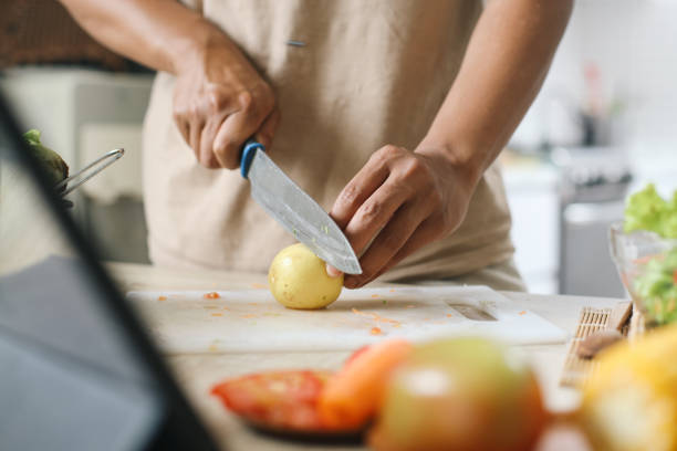 istock Man Making Salad In The Morning 2159141418