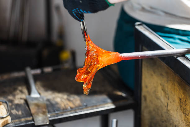 istock Molding molten glass into a flower shape 2159141646