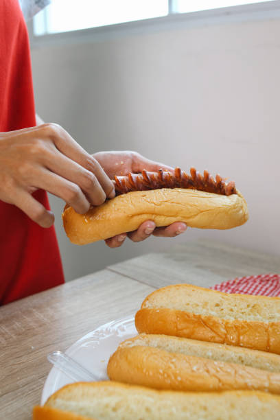 istock Making Sausage Hotdogs For Breakfast In The Morning 2159142055