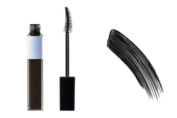 Mascara. Black mascara brush stroke with applicator brush isolated on white background.