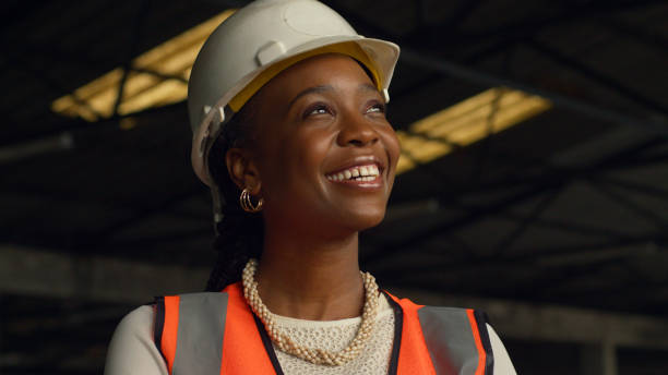 istock Smiling Black Female Engineer in Construction Site With Safety Gear and Hard Hat 2159149868