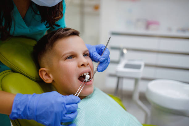 istock Boy receiving dental care from dentist during check-up 2159150343