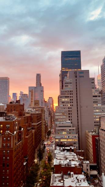 istock Beautiful sunset in downtown nyc seen from a rooftop bar 2159150436