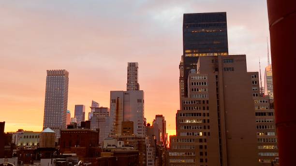 istock Beautiful sunset in downtown nyc seen from a rooftop bar 2159150456
