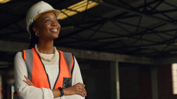 istock Confident Female Engineer at Construction Site Wearing Safety Gear 2159150845