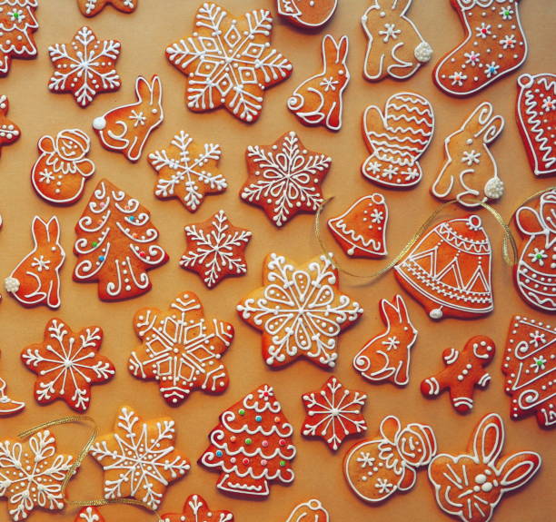 istock Assorted Christmas Gingerbread Cookies On Orange Background Top View 2159152290