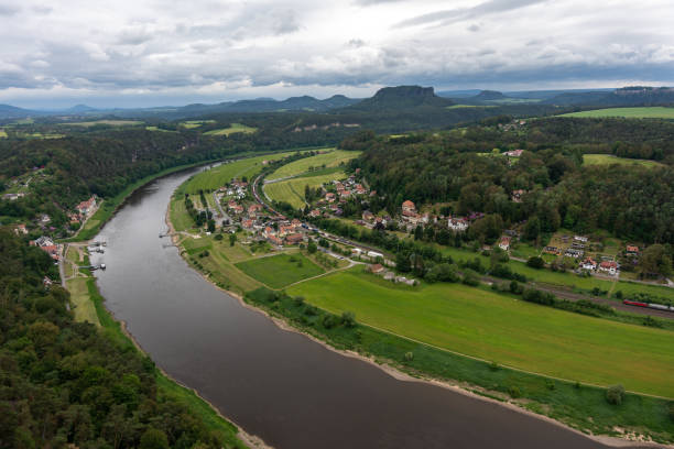 istock A river runs through a town with houses and a bridge 2159159116