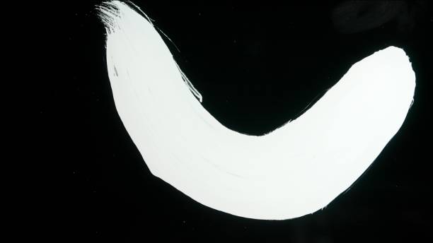 istock White paint streak drawn on glass surface. Drawing with white acrylic paint on black isolated background. Monochrome art painting, minimalism 2159159162