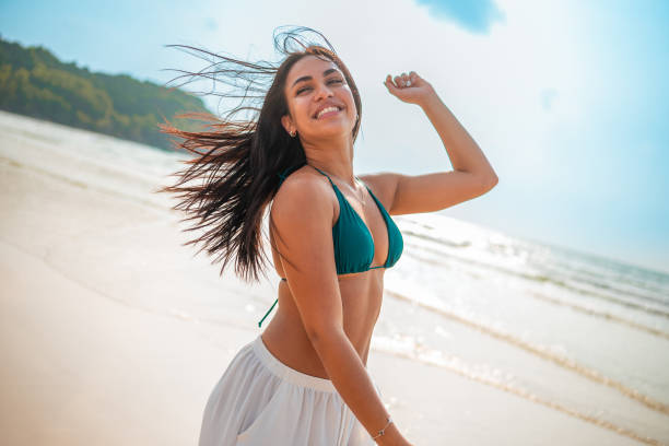 istock Joyful Hispanic Woman Enjoys Tropical Beach Getaway 2159160291