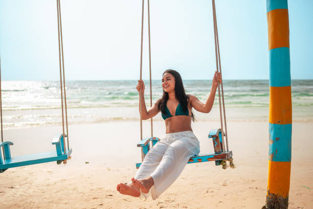 istock Serene Beachside Leisure Moment for Hispanic Woman 2159160348