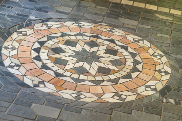 istock Small multi-colored floor tiles from which the eight-pointed star flower is assembled, which is of great importance in Islamic culture and religion. Well-known world sacred symbols. 2159160756