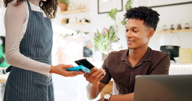 istock Customer, payment and cellphone with man, pos and transaction with internet, restaurant and laptop. People, client and waitress with service, smartphone and ecommerce with finance, app and payment 2159161491