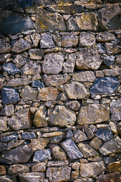 istock Retro style design decorative irregular cracked real stone wall surface motley stone 2159162144