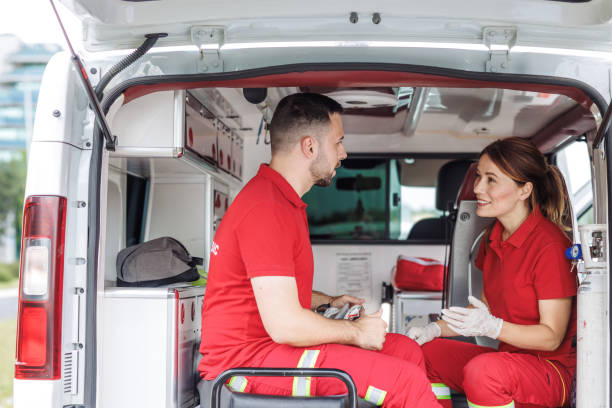 istock Paramedics in ambulance discussing emergency procedures 2159163959