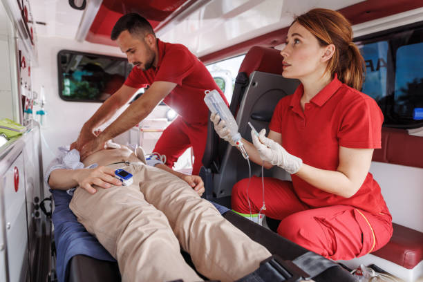 istock Emergency medical team assisting patient in ambulance 2159163971