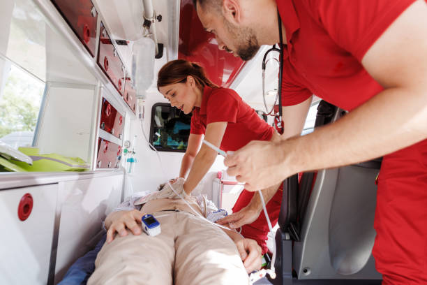 istock Emergency medical technicians providing care in an ambulance 2159164019