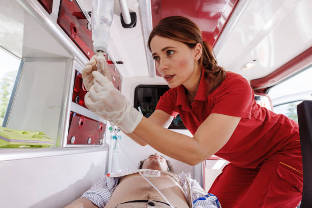 istock Paramedic administering treatment to patient inside ambulance 2159164052