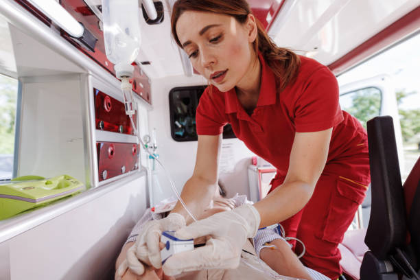 istock Paramedic providing emergency medical care inside ambulance 2159164085